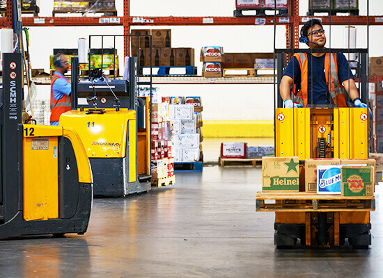 3 jungheinrich order pickers in use in warehouse